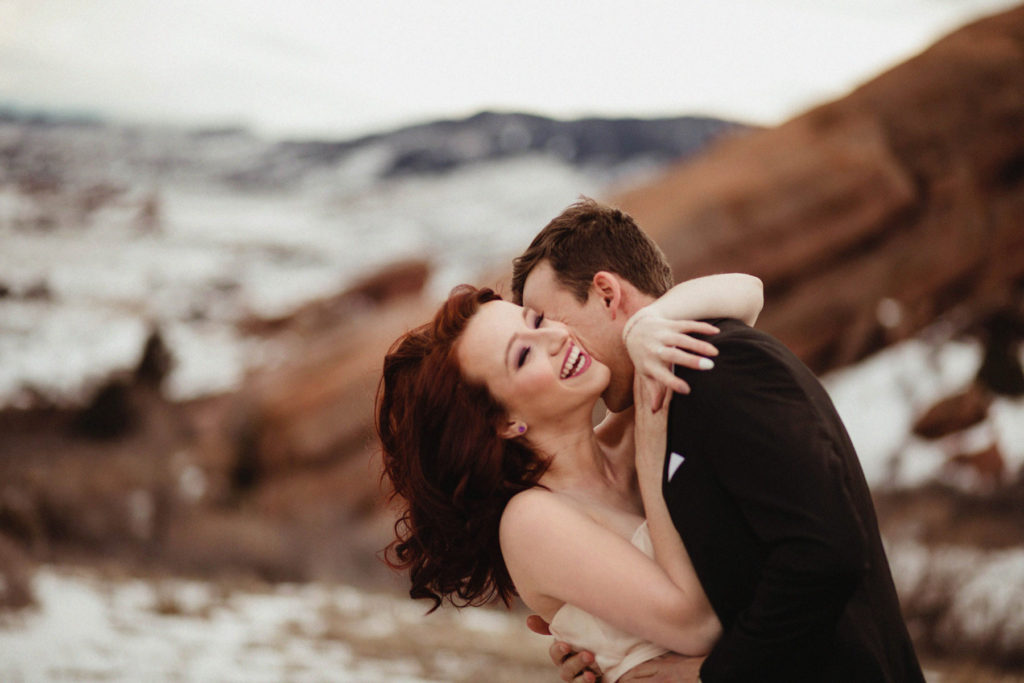 Wedding Professional Photographer in Denver, Colorado. Beautiful bride and groom in a professional photo session , Mountain view , hugging