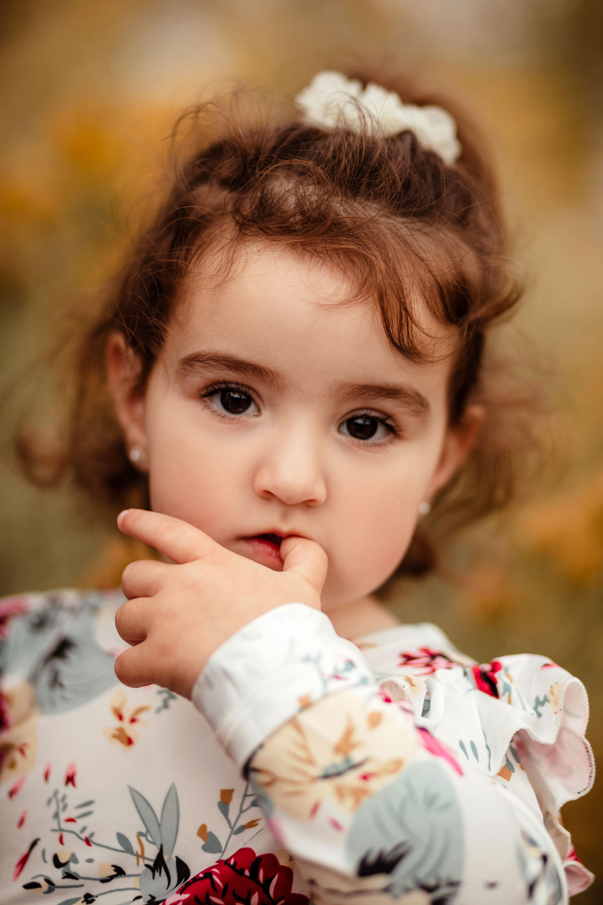 Stylish baby girl in family photo session. Family photos. Family photographer in Denver, Colorado